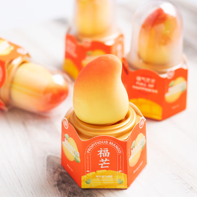 RD International Market Propitious Mango scented air freshener with mango-shaped design in orange packaging